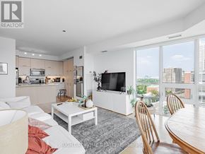 Toronto (Willowdale East) condo for rent - A modern living room with a flat screen TV and a view of the city.