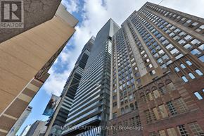 Toronto (Bay Street Corridor) condo for rent - A tall building with the words Union Capital Realty Brokerage on it.