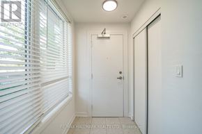 Pickering (Town Centre) townhouse for rent - A white door with a number 4 on it is in a room with white walls.