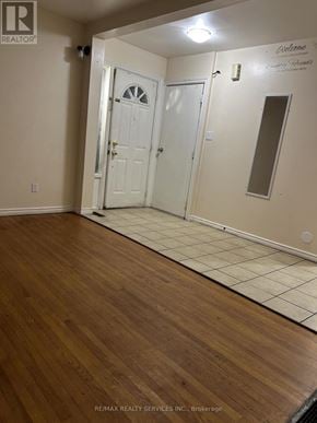 Brampton (Madoc) apartment for rent - A room with a white door and a mirror on the wall.