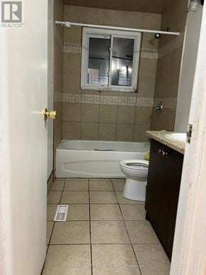 Brampton (Madoc) apartment for rent - A small bathroom with a toilet, tub, and sink.