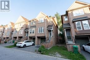 Mississauga (Hurontario) townhouse for rent - A white car is parked in front of a building with a Royal LePage Signature Realty logo.