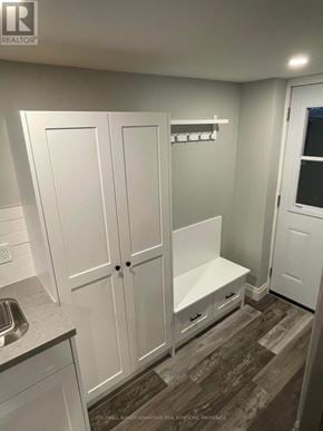 Welland (N. Welland) apartment for rent - A white kitchen with a sink and cupboards.