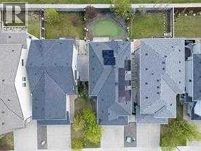 Calgary apartment for rent - A bird's eye view of a residential area with multiple houses.