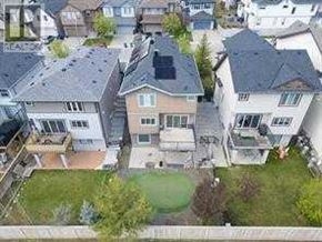 Calgary apartment for rent - A bird's eye view of a residential area with houses and green lawns.