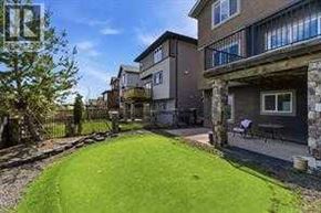 Calgary apartment for rent - A grassy area in front of apartment buildings.