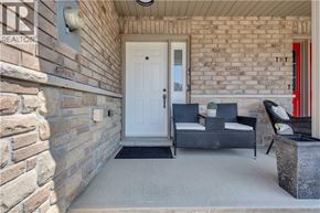 Brantford townhouse for rent - A white door is on the left and a red door is on the right.