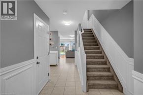 Brantford townhouse for rent - A hallway with a staircase leading to the second floor.