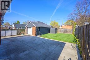 Hamilton apartment for rent - A house with a grey roof and a grey garage door.