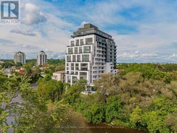 Guelph (St. Patrick's Ward) condo for rent - A real estate company logo is displayed on a building in the image.