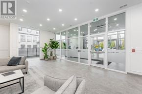 Guelph (St. Patrick's Ward) condo for rent - A realtor office with a couch and a coffee table.