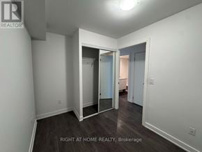 Toronto (Waterfront Communities) condo for rent - A room with a doorway leading to another room.