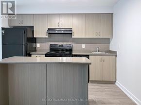 Toronto (Moss Park) condo for rent - A kitchen with a black fridge, stove, and oven.