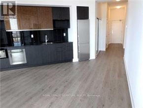 Toronto (Banbury-Don Mills) condo for rent - A kitchen with a refrigerator and a countertop.