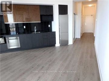 Toronto (Banbury-Don Mills) condo for rent - A kitchen with a refrigerator and a countertop.