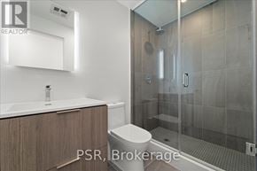 Toronto (Oakwood Village) condo for rent - A modern bathroom with a walk-in shower and a toilet.