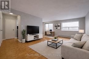 Toronto (Wexford-Maryvale) condo for rent - A living room with a television, couch, and coffee table.