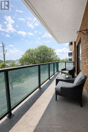 Toronto (Wexford-Maryvale) condo for rent - A balcony with a chair and a table with a plant on it.