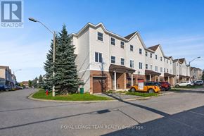 Ottawa townhouse for rent - A building with the text "ROYAL LEPAGE TEAM REALTY Brokerage" on the bottom right.