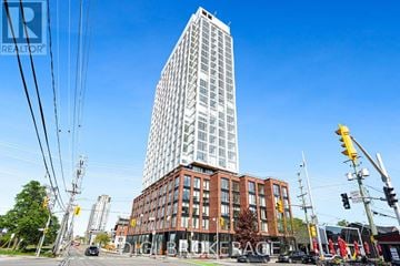 Ottawa condo for rent - A tall building stands next to a shorter one with the word "RACE" on the shorter building.