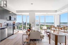 Ottawa condo for rent - A modern kitchen and living room with a view of the city.