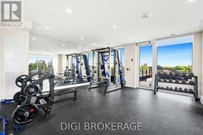 Ottawa condo for rent - A well-equipped gym with a view of the cityscape outside.