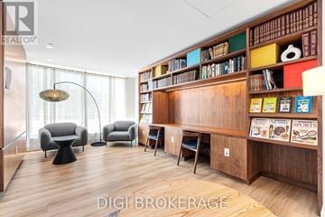 Ottawa condo for rent - A living room with a bookshelf filled with books and magazines.