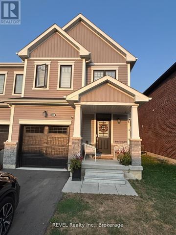 Thorold (Rolling Meadows) townhouse for rent - A house with a brown and beige exterior is for sale with REVEL Realty Inc.