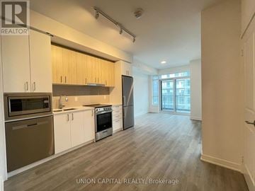 Vaughan (Brownridge) condo for rent - A kitchen with wooden cabinets and stainless steel appliances.