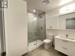 Vaughan (Brownridge) condo for rent - A bathroom with a toilet, sink, and shower.