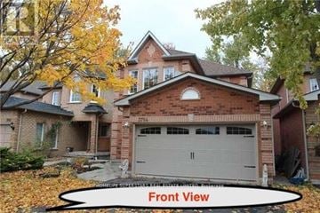 Mississauga (Lisgar) apartment for rent - A house with a front view and a garage.
