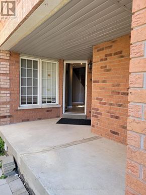 Mississauga (Lisgar) apartment for rent - A house entrance with a door and a window.
