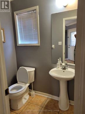 Mississauga (Lisgar) apartment for rent - A white toilet and sink in a bathroom.