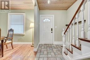 Burlington (Brant) apartment for rent - A white door with a window above it and a wooden chair to the left.
