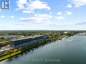 Welland (Broadway) condo for rent - A real estate brokerage office overlooks a river.