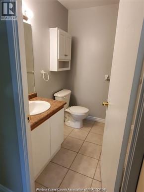 Windsor condo for rent - A bathroom with a toilet, sink and medicine cabinet.
