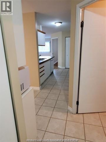 Windsor condo for rent - A kitchen with white appliances and a white refrigerator.