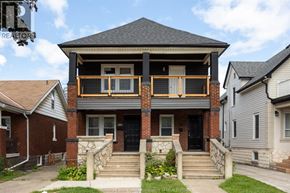 Windsor apartment for rent - A house with a balcony and a black door.