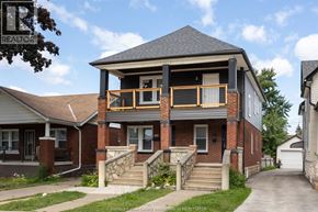 Windsor apartment for rent - A house with a balcony and a sign that says REALTOR.