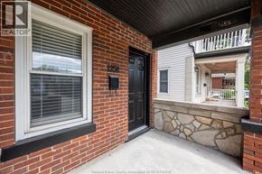 Windsor apartment for rent - A black door with a window and a brick wall.