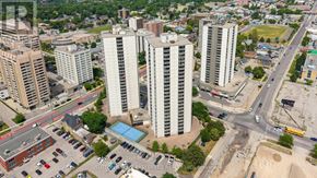 London East (East K) condo for rent - A cityscape with tall buildings and a busy intersection.