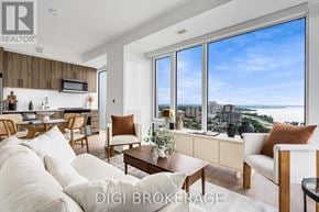 Ottawa condo for rent - A modern living room with a view of the city.