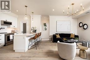 Lasalle condo for rent - A modern kitchen with a black and white theme.