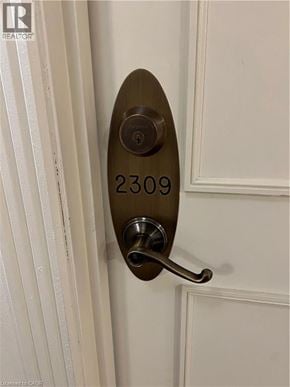 Toronto condo for rent - A door handle with the number 2309 on it.