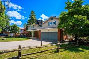 Richmond Hill (South Richvale) apartment for rent - A house with a garage and a driveway in front of it.