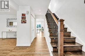 Richmond Hill (South Richvale) apartment for rent - A hallway with a staircase and a table with chairs.