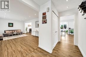 Richmond Hill (South Richvale) apartment for rent - A spacious living room with a grey sofa and a coffee table.