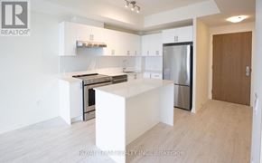 Vaughan (Vellore Village) condo for rent - A white kitchen with a refrigerator, oven, and sink.