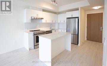 Vaughan (Vellore Village) condo for rent - A white kitchen with a refrigerator, oven, and sink.