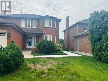 Oakville (Wc Wedgewood Creek) apartment for rent - A house with a red brick exterior and a white garage door is for sale.